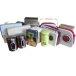 A collection of novelty tins - three modelled as radios, six similar of Paris, custard creams,