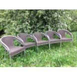 A set of five tubular chrome metal chairs with rounded frames, having faux cane backs & seats,