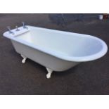 A Victorian 6ft cast iron roll-top bath, with rounded angled end opposite fitted original chrome