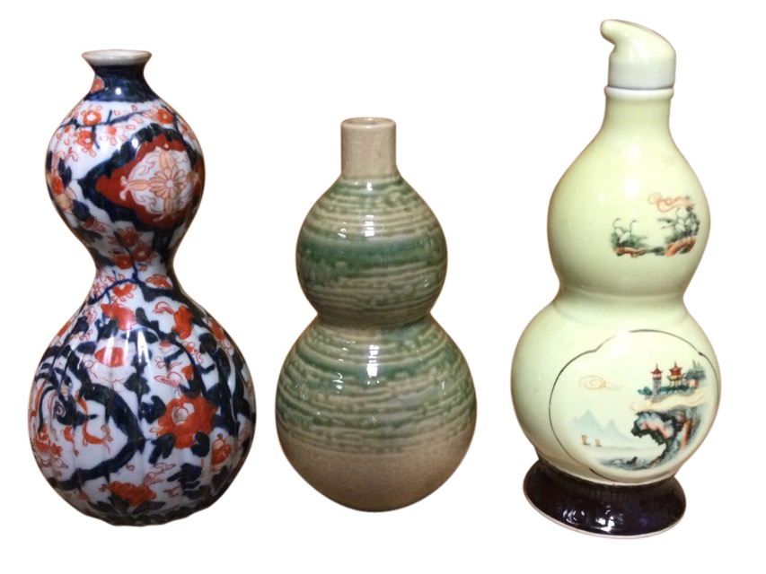 Three gourd shaped ceramic vases - ribbed and decorated in the Imari palette, mottled sancai type