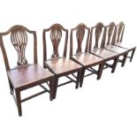 A set of six nineteenth century country oak Hepplewhite style dining chairs, the arched backs with