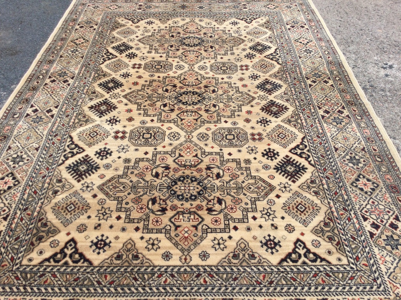 A Belgian eastern style rug woven with three oval stepped medallions on fawn field bordered to sides - Image 2 of 3