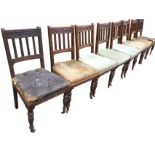 A set of eight nineteenth century oak dining chairs, the moulded back rails carved with acorns &