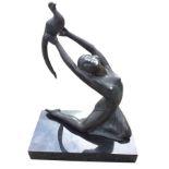 A French art deco style spelter figure of a dancing girl after Salvado, the bronze patinated lady