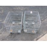 A pair of rectangular galvanised metal trolley bins, each on four casters. (32.5in x 24.25in x 31.