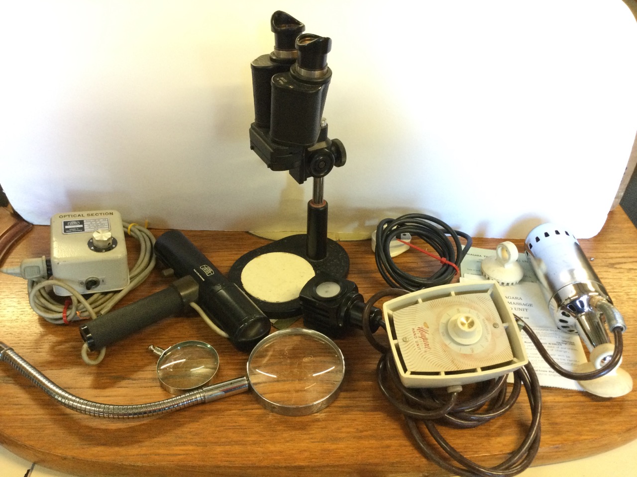 A Carl Zeiss optical torch type instrument with control panel; another electrical optical piece by