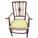 An Edwardian mahogany armchair inlaid with boxwood stringing, the back with slender spindles