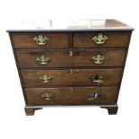 A Georgian mahogany chest of drawers with rectangular moulded top above two short and three long