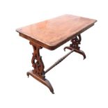 A Victorian walnut centre table, with rectangular rounded top above a plain frieze, raised on