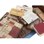 Several sets of Lotts composition stone bricks, the pieces in wood trays & boxes, with some original