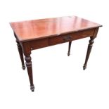 A Victorian mahogany side table with rectangular moulded top above a central frieze drawer, raised