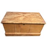 A rectangular Victorian pine blanket box of dovetailed construction mounted with oval brass