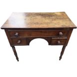 A Gillow style nineteenth century mahogany dressing table, the rectangular top above a long panelled