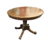 A mahogany drum table, the circular top inlaid with boxwood & ebony stringing above a plain apron,