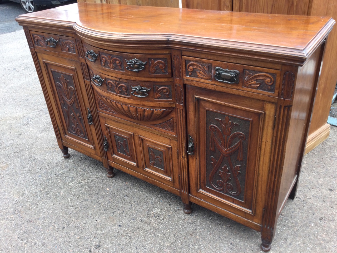 A Victorian carved walnut sideboard, the bowfronted central section with two drawers above a - Image 2 of 3