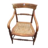 A nineteenth century mahogany elbow chair with curved bar back above a twisted turned rail, the arms