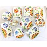A suite of shaped handpainted serving bowls & platters with colourful floral decoration - probably
