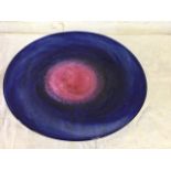 A signed circular swirling blue & pink art glass platter by Annette Krahner. (14.75in)