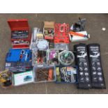 A collection of tools, many for mechanic and plumbing use - socket sets, wrenches, a bearing puller,