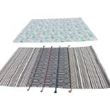 A rectangular Indian cotton wallhanging of grey striped monochrome design having applied coloured