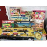 A boxed Cat construction set with train track, engines, trucks, etc; and a quantity of board and