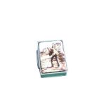 A rectangular silver pill box, the hinged lid with enamelled scene of an old golfer in front of a