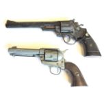 A replica Magnum 44 revolver, model no 647 - 14.5in; and a replica western type six-shooter with