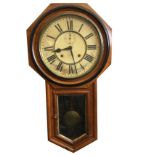 A Victorian mahogany wallclock with movement by The Ansonia Clock Company, the octagonal case with