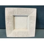 A square biscuit fired Troika dish with incised geometric decoration to angled rim. (10in)