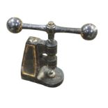 A Victorian heavy cast iron press on stand with screw mechanism, having panted gilt decoration,