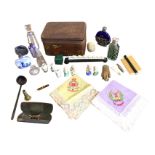 Miscellaneous items including scent bottles, an otter paw brooch with silver collar, miniature