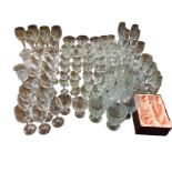A collection of glasses, including many sets - wine glasses, flutes, hi-balls, tumblers, goblets,