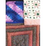 Two contemporary patchwork quilts; and a 50s Velo down quilt. (3)