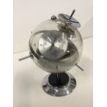 A 70s West German barometer by Huger, the sputnik type globe on chrome ebonised stand, with silvered