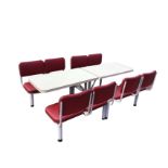 A pair of formica topped cafŽ tables, the tubular metal frames each with four upholstered seats on