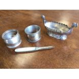Two hallmarked silver napkin rings; a hallmarked silver fruit knife with mother-of-pearl handle; and
