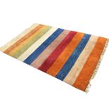 A contemporary thick-pile striped Indo Gabbeh wool rug. (81in x 55in)