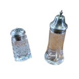 A rectangular tapering cut glass caster with domed hallmarked silver pierced cover; and another