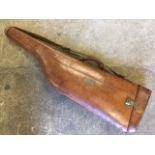 A Victorian leather shoulder of mutton gun case with brass mounts, the case with nameplate -