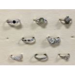 Miscellaneous silver, white gold & platinum rings - an eternity band, a 9ct half-eternity ring
