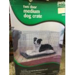 A boxed folding dog cage, complete with tray. (36in x 22.5in x 24in)