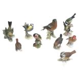 A collection of eight Goebel porcelain birds; and a Beswick goldfinch. (9)