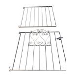 Two wrought iron garden gates, one with scrolled panel, with latch, the other with vertical bars. (