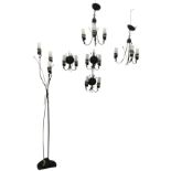 A suite of contemporary wrought iron lighting with tubular acid etched glass shades in scrolled