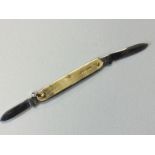 A 9ct gold penknife with engine turned decoration to side panels, the loop stamped Made in