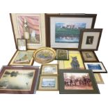 A box of miscellaneous pictures, prints, unused frames, etc., including old photographs,