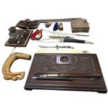 Miscellaneous desktop collectors items including a carved desktidy, a carved horn stick handle, a