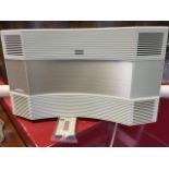 A Bose acoustic wave music system with remote. (18in x 11in x 10.75in)