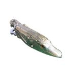 A silver plated stationery clip modelled as a pike head, the sprung hinged fish inalid with glass