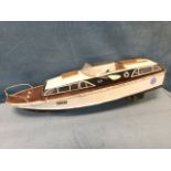 A C20th model cruiser, the clinker built painted boat with mahogany deck, internally equipped for